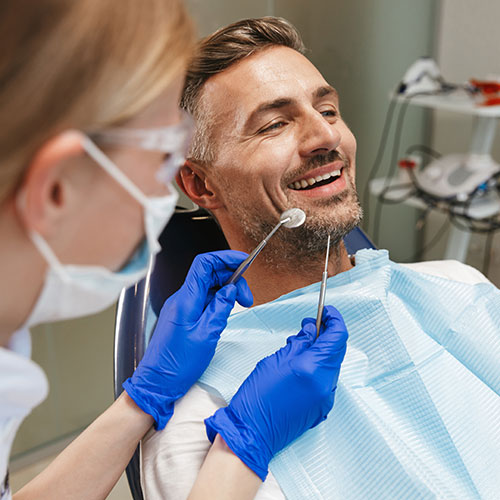 middle aged man in dentists chair